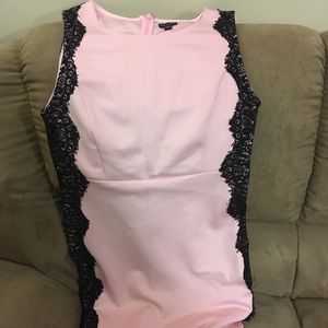 Pink fitted dress with black lace detail